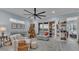 Comfortable living room with a ceiling fan, cozy seating, and sliding glass doors at 3270 Green Heron Dr, Polk City, FL 33868