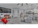 Cozy living room featuring a modern fireplace and stylish decor flowing into an open kitchen at 3270 Green Heron Dr, Polk City, FL 33868