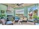 Inviting outdoor living area with a grill, comfortable seating, and serene views at 3270 Green Heron Dr, Polk City, FL 33868