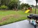 Expansive backyard features a swing set, fire pit, and plenty of room to roam at 3646 Sherertz Road, Lakeland, FL 33810