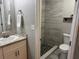 Tidy bathroom featuring a shower, a toilet and granite countertops at 3646 Sherertz Road, Lakeland, FL 33810