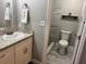 Tidy bathroom featuring a shower, a toilet and granite countertops at 3646 Sherertz Road, Lakeland, FL 33810
