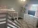 Bright bedroom with bunk bed, dresser, plush carpet, and natural light at 3646 Sherertz Road, Lakeland, FL 33810