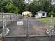 Gated property with workshop and security cameras for added privacy and protection at 3646 Sherertz Road, Lakeland, FL 33810