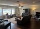 Cozy living room with a large TV, plush seating, and bright natural light at 3646 Sherertz Road, Lakeland, FL 33810