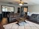 Comfortable living room with plush seating, area rug, and access to other rooms at 3646 Sherertz Road, Lakeland, FL 33810