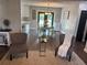 Open concept living and dining area with wood floors and gray color scheme at 3646 Sherertz Road, Lakeland, FL 33810