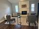 Living room with wood floors, area rug, fireplace, and comfortable seating at 3646 Sherertz Road, Lakeland, FL 33810