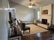 Cozy living room with fireplace, area rug, and comfortable seating at 3646 Sherertz Road, Lakeland, FL 33810