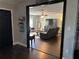 Open-concept living room with comfortable seating, media center, and connecting rooms at 3646 Sherertz Road, Lakeland, FL 33810