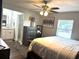 Well-lit main bedroom featuring wood-look floors and ensuite bathroom at 3646 Sherertz Road, Lakeland, FL 33810