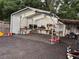 Brightly lit workshop area featuring shelving, work benches, and tool storage at 3646 Sherertz Road, Lakeland, FL 33810