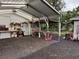 Brightly lit workshop area featuring shelving, work benches, and tool storage at 3646 Sherertz Road, Lakeland, FL 33810