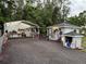 Exterior view of workshops featuring tool storage, lighting, and exterior access at 3646 Sherertz Road, Lakeland, FL 33810