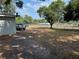 Backyard with truck in driveway and chain link fence at 3651 Rifle Range Rd, Winter Haven, FL 33880