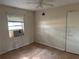 A bedroom with tiled floors and painted walls at 3651 Rifle Range Rd, Winter Haven, FL 33880
