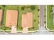Aerial view of the home showing its tiled roof, backyard, and proximity to neighboring properties at 3934 Aquilla Dr, Lakeland, FL 33810