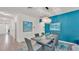 Elegant dining room features stylish lighting, an eye-catching accent wall, and chic decor, creating a sophisticated ambiance at 3934 Aquilla Dr, Lakeland, FL 33810