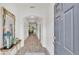 Welcoming entryway boasting an arched ceiling, wood flooring, and neutral paint colors at 3934 Aquilla Dr, Lakeland, FL 33810