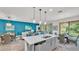 Open living space featuring a kitchen island, dining area, and a comfortable living room at 3934 Aquilla Dr, Lakeland, FL 33810