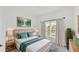Serene main bedroom featuring soft decor, a large window, and ample natural light at 3934 Aquilla Dr, Lakeland, FL 33810