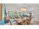 Bright open concept floor plan features a dining area, kitchen with breakfast bar, and large living room at 3934 Aquilla Dr, Lakeland, FL 33810