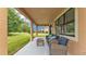 Inviting covered patio with comfortable seating and serene backyard views at 3934 Aquilla Dr, Lakeland, FL 33810