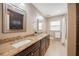 Well-lit bathroom features double sinks, granite countertops, and a shower/tub combo at 4006 Glen Garry W Rd, Lakeland, FL 33813