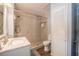 Bathroom with a glass enclosed shower, white vanity, and a wood look floor at 4006 Glen Garry W Rd, Lakeland, FL 33813