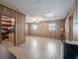 A large bonus room featuring paneled walls, offering ample space and versatility for various activities and enjoyment at 4006 Glen Garry W Rd, Lakeland, FL 33813