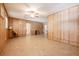 Open bonus room with paneled walls and tile flooring, offering flexible living space and a cozy ambiance at 4006 Glen Garry W Rd, Lakeland, FL 33813