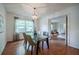 Dining room with hard wood floors and views into the living room at 4006 Glen Garry W Rd, Lakeland, FL 33813