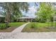 Charming single-story home with a lush front yard, mature trees, and a welcoming entrance at 4006 Glen Garry W Rd, Lakeland, FL 33813