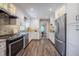Spacious kitchen features recessed lighting, stainless steel appliances, and bright white cabinetry at 4006 Glen Garry W Rd, Lakeland, FL 33813
