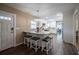 Bright kitchen boasts wood flooring, marble countertops, stainless steel appliances, and a large island at 4006 Glen Garry W Rd, Lakeland, FL 33813