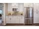 Spacious kitchen features stainless steel appliances, bright white cabinetry, and marble countertops at 4006 Glen Garry W Rd, Lakeland, FL 33813