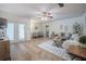 Spacious living room features tile flooring, neutral paint, and plenty of natural light at 4006 Glen Garry W Rd, Lakeland, FL 33813