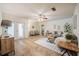 Bright living room featuring neutral paint, ceiling fan, and an abundance of natural light from the nearby French doors at 4006 Glen Garry W Rd, Lakeland, FL 33813