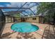 Backyard view of screened pool, with brick pavers surrounding it, perfect for enjoying sunny days outdoors in privacy at 4006 Glen Garry W Rd, Lakeland, FL 33813
