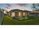 A screened-in porch overlooking a lush backyard, offering a private outdoor living space at 4088 Prima Lago Cir, Lakeland, FL 33810