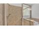 Stylish bathroom featuring a glass shower enclosure and neutral tile at 4088 Prima Lago Cir, Lakeland, FL 33810