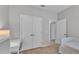 Bedroom featuring neutral walls, carpeted floors, a bed, and a double-door closet, offering ample storage space at 4088 Prima Lago Cir, Lakeland, FL 33810