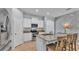 Stylish kitchen with white cabinets, stainless steel appliances, and a granite-topped island with seating at 4088 Prima Lago Cir, Lakeland, FL 33810
