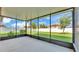 Screened patio with views of the lawn, landscaping, and white fence providing an ideal space for outdoor entertainment at 4088 Prima Lago Cir, Lakeland, FL 33810