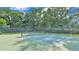 A well-maintained pickleball court with a net and surrounding fence, ready for a game at 4088 Prima Lago Cir, Lakeland, FL 33810