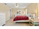 Bright bedroom with a comfortable bed, tiled floor and neutral tones at 4219 Sunny Land Dr, Lakeland, FL 33813