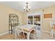 Bright dining area featuring a table with tile top, pendant lighting and sliding glass door at 4219 Sunny Land Dr, Lakeland, FL 33813