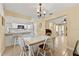 Cozy dining area next to the kitchen with a tile-top table and bright natural light at 4219 Sunny Land Dr, Lakeland, FL 33813