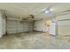 Spacious garage featuring an automatic door and plenty of storage space at 4219 Sunny Land Dr, Lakeland, FL 33813