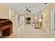Bright living room featuring tile floors, neutral tones, and an adjacent dining area at 4219 Sunny Land Dr, Lakeland, FL 33813